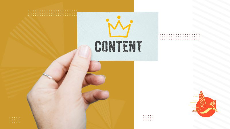 Hand holding a card with the word "content" and a crown