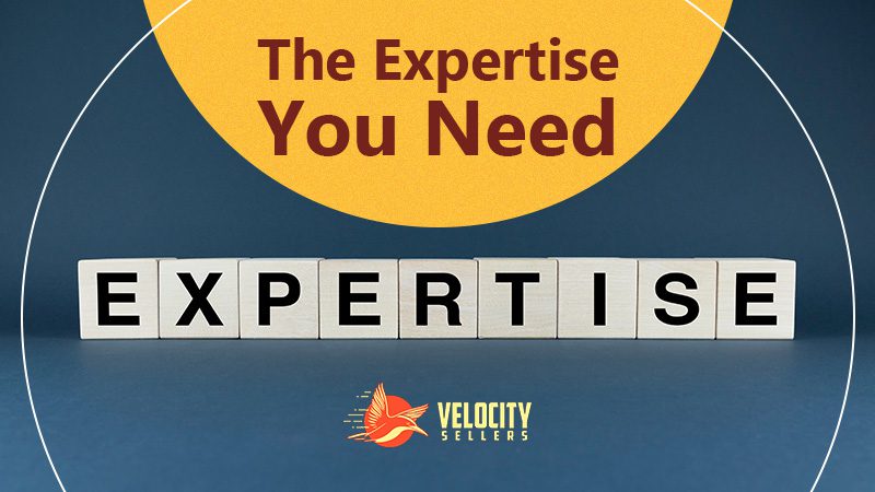 Full-Service Amazon Management: Wooden blocks spelling 'EXPERTISE' on a blue background, showcasing the essential expertise offered by Velocity Sellers.