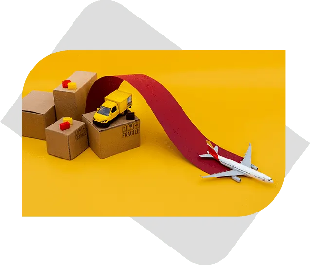 Four boxes arranged on a bright yellow background featuring a yellow toy truck on one box, draped with a red carpet, with a toy airplane positioned on the carpet.